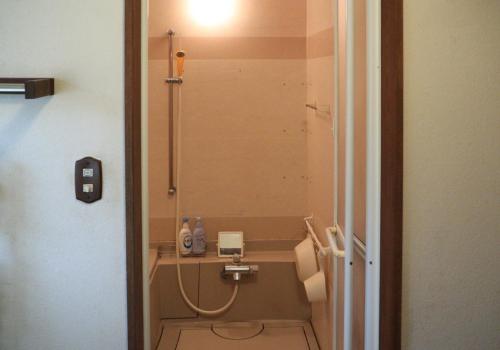 a small bathroom with a shower and a toilet at Guesthouse Coteau - Vacation STAY 5450 in Biei