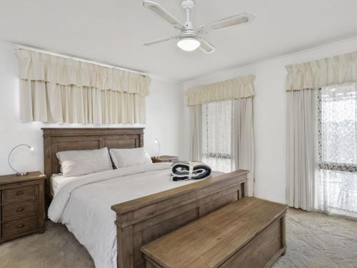 a bedroom with a large bed and a ceiling fan at Francis Geelong 156 in Belmont