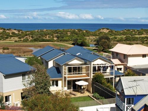 an image of a house with solar panels on its roof at Esplanade Frontage 219a in Torquay