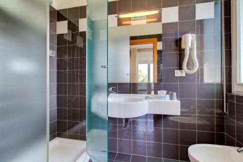 Koupelna v ubytování Hotel Ivano