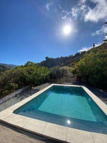a swimming pool in the middle of a yard at La cara Luna in Santa Brígida
