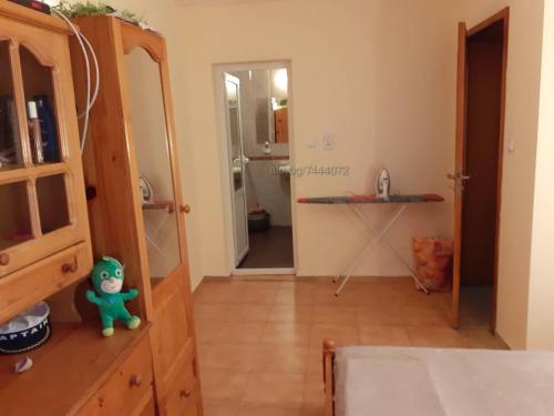 a room with a mirror and a room with a kitchen at Private Studio Intsaraki - Sveti Vlas in Sveti Vlas