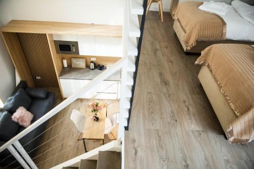 two views of a living room and a bedroom at FRIENDS RESIDENCE Apartments in Timişoara
