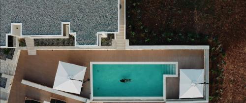 an overhead view of a swimming pool on a building at K Villas in Plataria