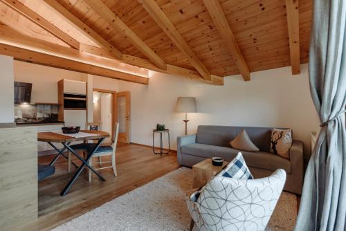 a living room with a couch and a table at Ferienwohnungen Renberg in Maria Alm am Steinernen Meer