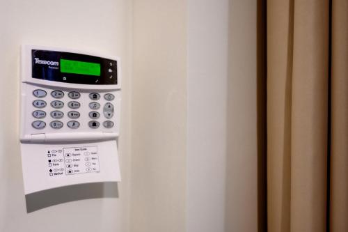 a close up of a calculator on a wall at BLACKHAUS Apartments in Thessaloniki