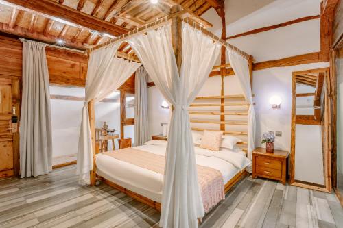 Postel nebo postele na pokoji v ubytování Chunjian Guesthouse