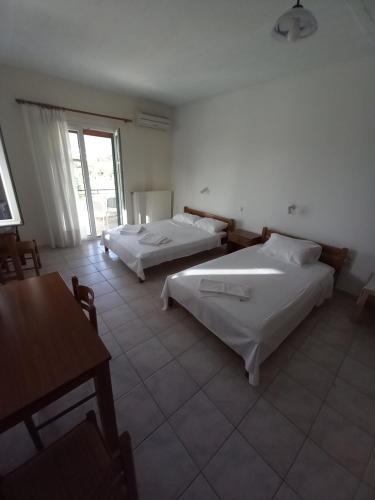Ένα ή περισσότερα κρεβάτια σε δωμάτιο στο Lontza Apartments