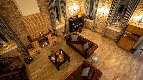 an overhead view of a living room with couches and tables at Villa Pietra in Ayvalık