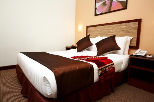 A bed or beds in a room at TH Hotel Kelana Jaya