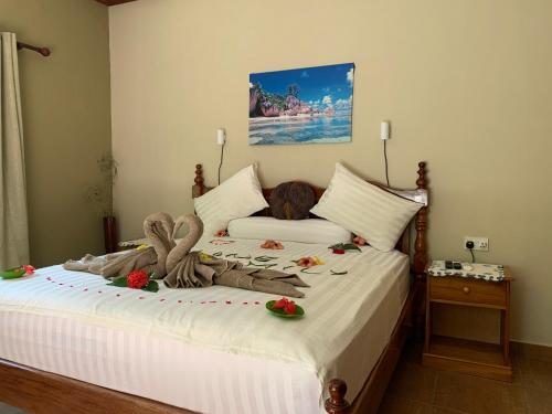 Letto o letti in una camera di Island Bungalow