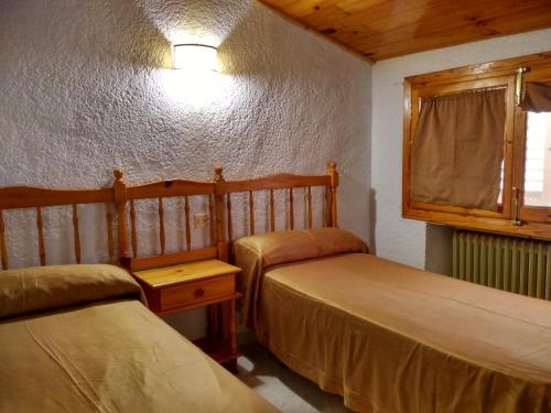 Postel nebo postele na pokoji v ubytování Pensión Rural Arroyo la Teja