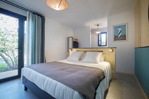 Postel nebo postele na pokoji v ubytování HOTEL COTE PHARE