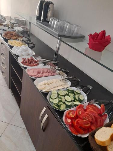 a buffet line with many different types of food at Hotel Wave in Batumi