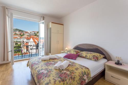 Postel nebo postele na pokoji v ubytování Apartments Sanja