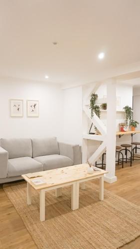 a living room with a couch and a coffee table at 262 Baixa Guesthouse in Lisbon