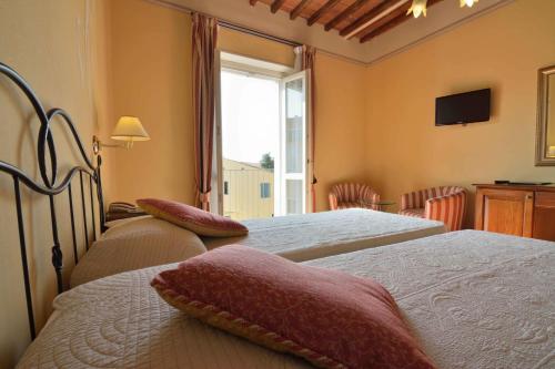 Postel nebo postele na pokoji v ubytování Hotel Di Stefano