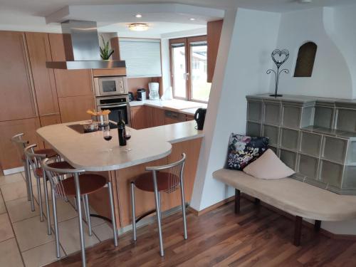 a kitchen with a table and chairs in a room at Ferienwohnung Alte Post in Sankt Leonhard im Pitztal