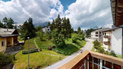 a view of a street from a balcony at Abitaziun Blaunca - Maloja in Maloja
