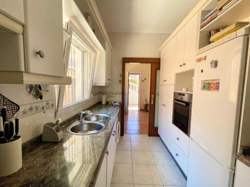 a kitchen with a sink and a counter at Benidorm Eye Villa in Benidorm