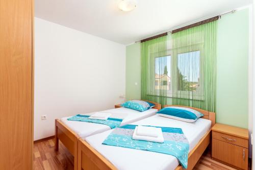Postel nebo postele na pokoji v ubytování Dragan K1
