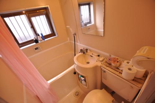 a bathroom with a sink and a toilet and a mirror at FUJIハイツ #国分寺 #東京&新宿&吉祥寺&高尾山 直行 #TOKYO Kokubunji 10min!! Easy to Shinjuku&SHIBUYA in Kokubunji