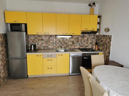 Kuchyň nebo kuchyňský kout v ubytování Apartman Ante