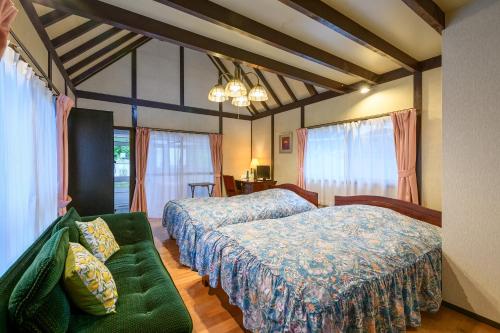 Ένα ή περισσότερα κρεβάτια σε δωμάτιο στο Tabist Sakura Annex Okumikawa