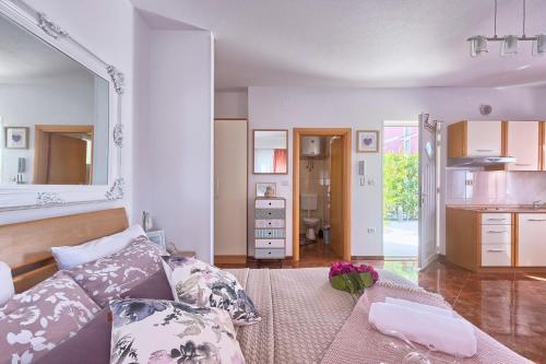 a living room with a couch and a table at Villa Mihaela in Fažana