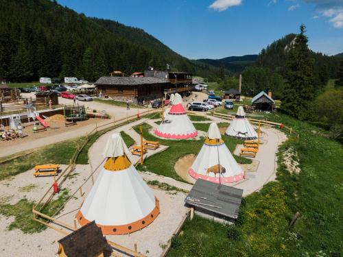 an aerial view of a park with many tents at Ranč pod Ostrou Skalou in Stratená