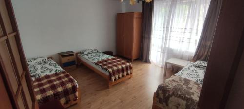 Postel nebo postele na pokoji v ubytování Pokoje gościnne u Sławka