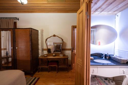 a bathroom with a sink and a mirror at Cedrus Hotel in Antalya