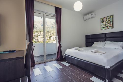Postel nebo postele na pokoji v ubytování Apartments Atlantis