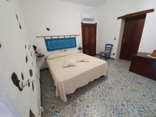 Posteľ alebo postele v izbe v ubytovaní Casa Vacanza Sa Prenda