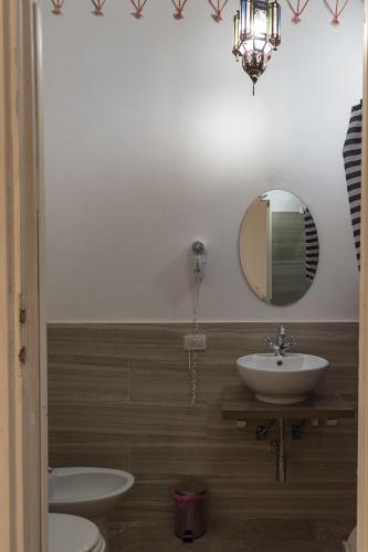 a bathroom with a sink and a mirror at Antica Terrazza Frascati in Frascati