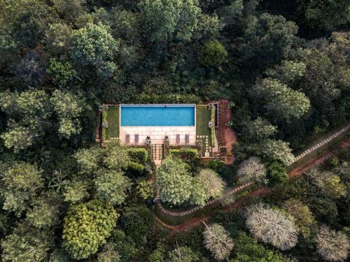 an aerial view of a building in the middle of a forest at Pepper Trail in Sultan Bathery