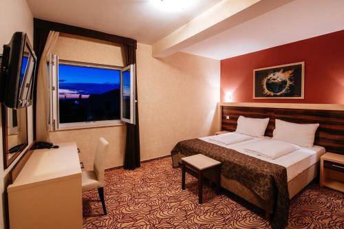 Säng eller sängar i ett rum på Hotel Terra