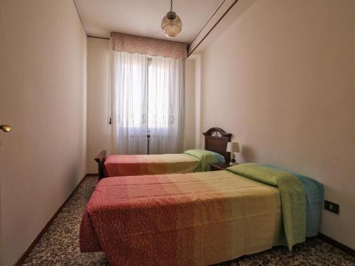 A bed or beds in a room at Residenza Parco Ducale 2