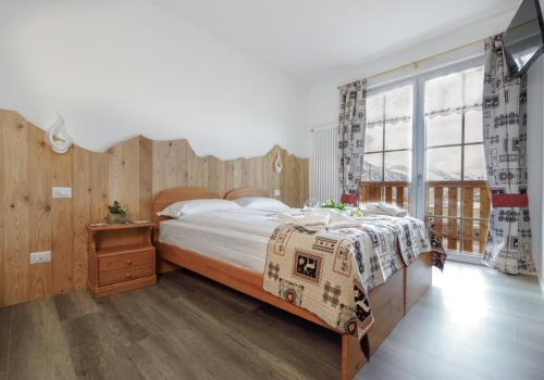 Postel nebo postele na pokoji v ubytování Albergo Ristorante Le Alpi