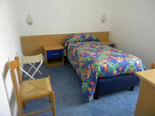 Postel nebo postele na pokoji v ubytování Albergo Locanda Sul Mare