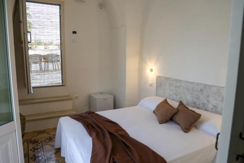 Cama o camas de una habitación en CORTE LARGO LAURO DIMORE & SPA