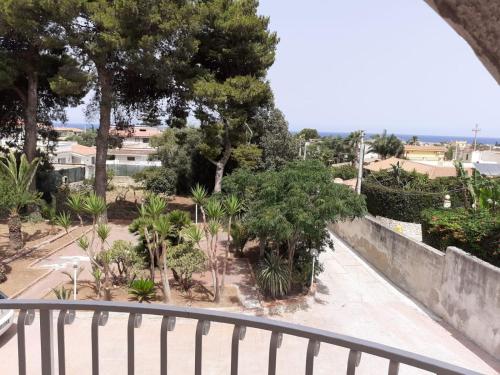 a view of a park from a balcony at Villa magaggiari 2 in Cinisi