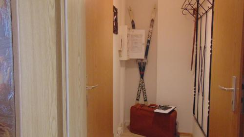 a room with a door and a suitcase in a hallway at Ferienwohnung Ernst 10 in Gelenau