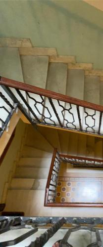 a staircase in a building with a metal railing at Edo apartament in Lido di Ostia