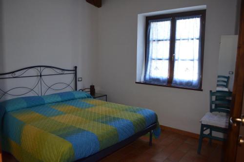 Postel nebo postele na pokoji v ubytování Il Vigneto