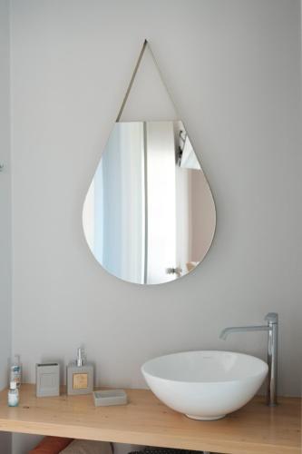 a bathroom with a white sink and a mirror at Marilena Apartments in Sidari