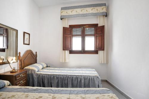 Ένα ή περισσότερα κρεβάτια σε δωμάτιο στο Casa Carmen - Sólo Familias