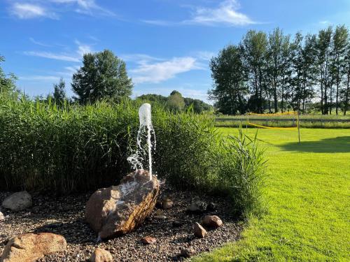 a stream of water coming out of a fountain at Appartementanlage Lancken-Granitz in Lancken-Granitz