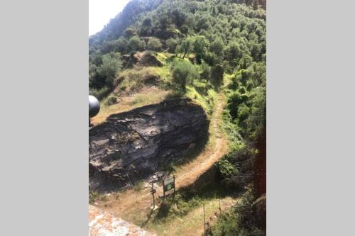 a view of a mountain with a road on it at Alloggio U SPORTEGU DA E MONTI A GIAIA in Badalucco