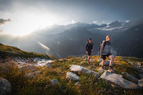 two people standing on top of a mountain at BRUGGER ApartHotel in Mayrhofen